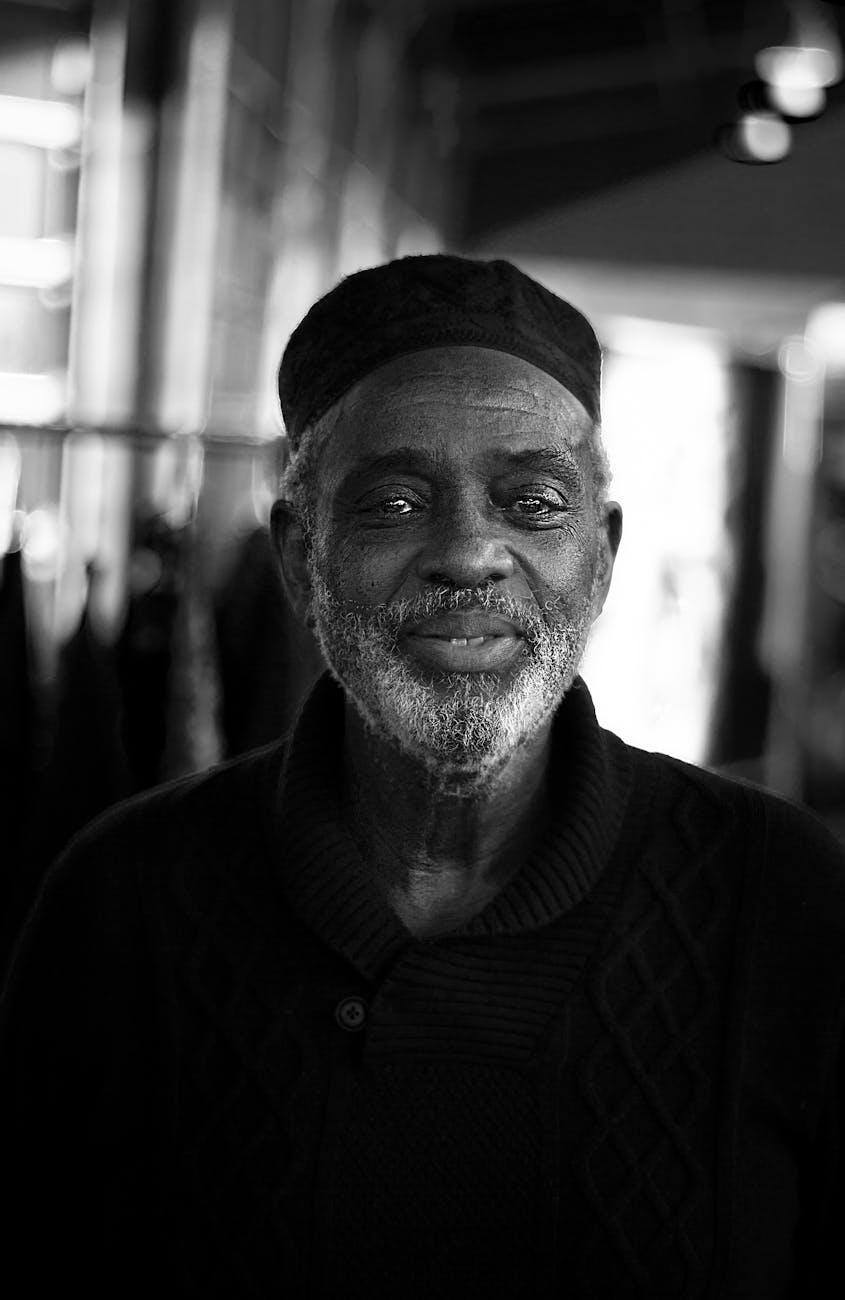 Elegant black and white portrait capturing the wisdom of a senior African man.